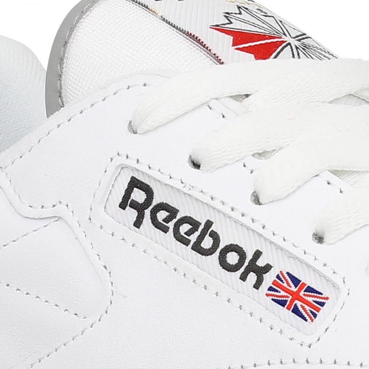 reebok blanche rouge Cinosural International School